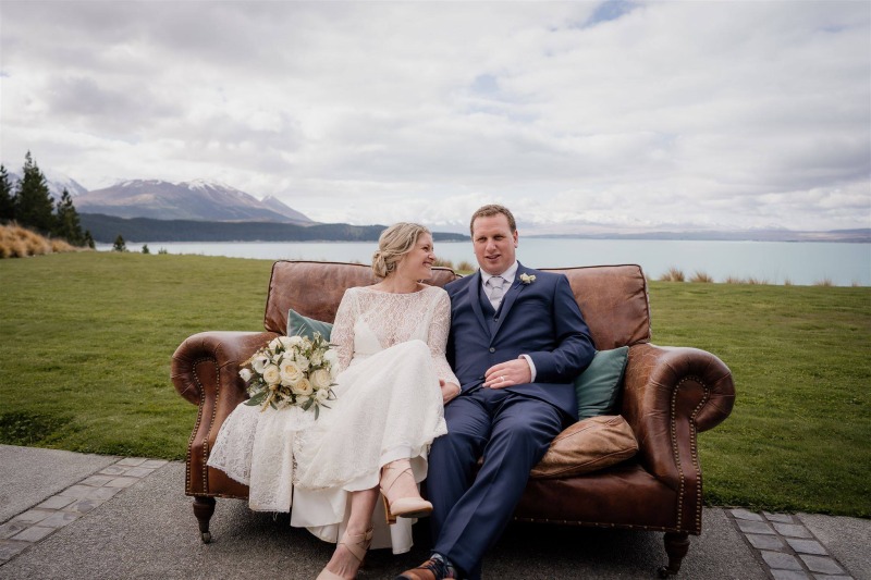wedding couple posing for photographs at mt cook lakeside retreat