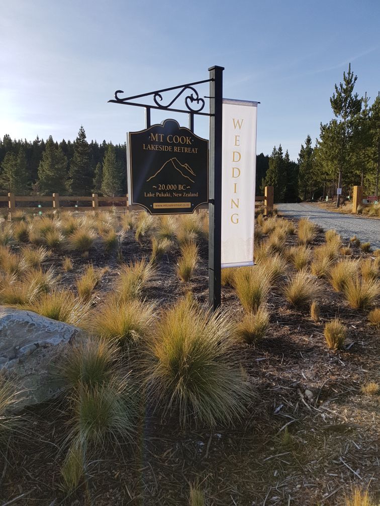 mt cook lakeside retreat wedding sign at gate